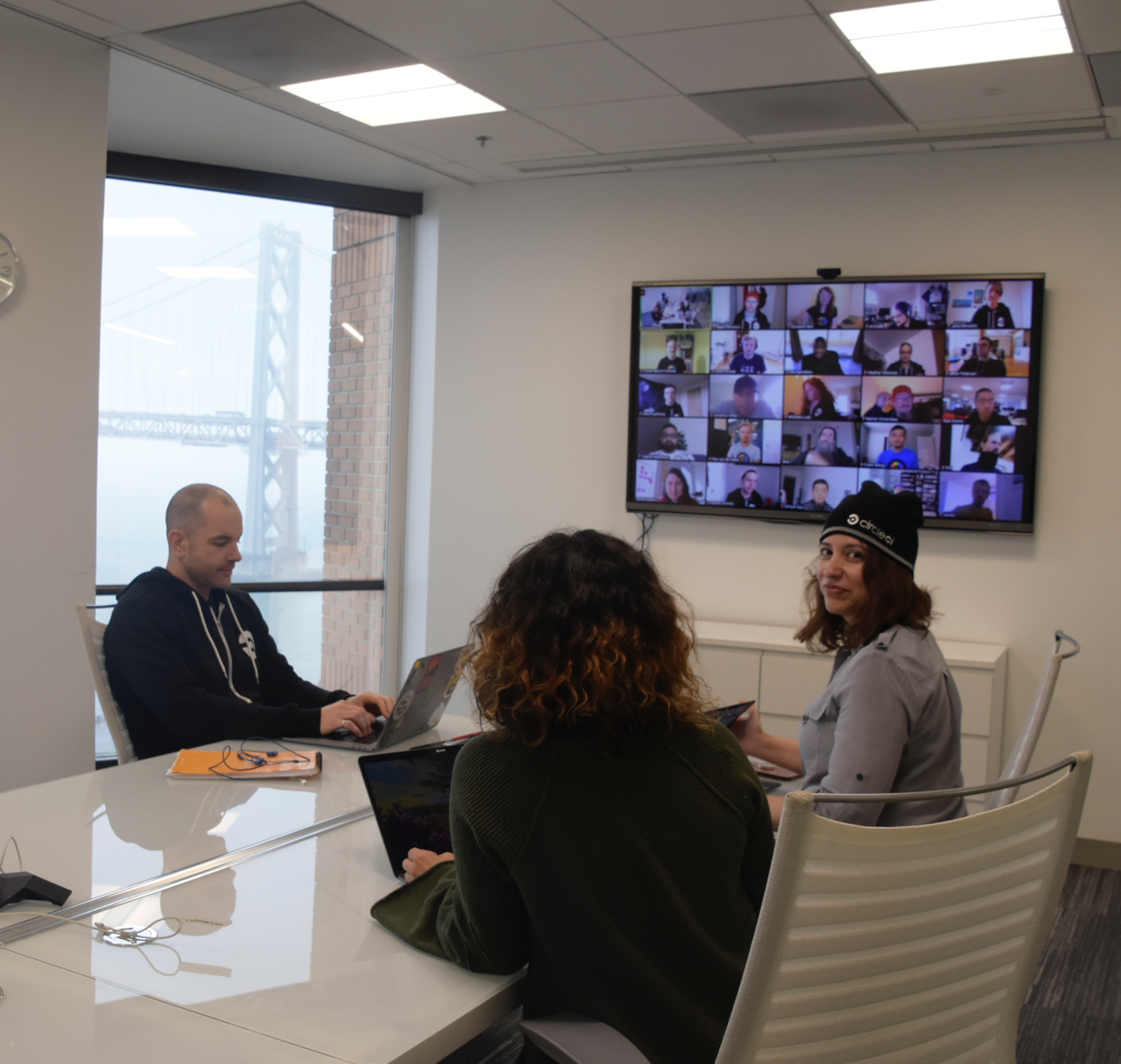 Team members on a Zoom call holding waffles.