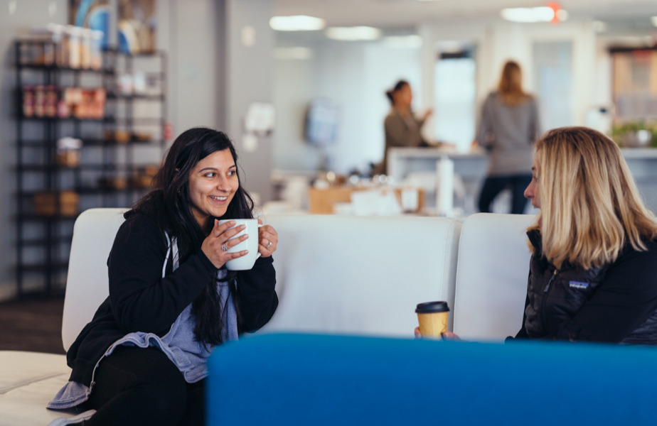 Team members enjoying hot beverages in an open area in the San Francisco office.